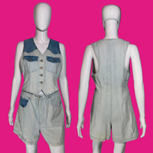Load image into Gallery viewer, A sleeveless denim shortalls jumpsuit shown on a white mannequin from both front and back views, featuring a light wash with darker blue contrast panels on the chest and waist.