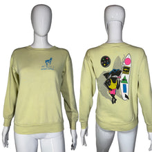 Load image into Gallery viewer, Light yellow sweatshirt with 'Maui and Sons' logo on front and colorful graphic on back, displayed on mannequins.