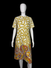 Load image into Gallery viewer, Yellow and white patterned dress on a mannequin