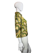 Load image into Gallery viewer, Mannequin wearing a green patterned garment on a plain background