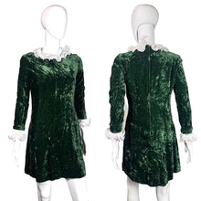 Load image into Gallery viewer, Green velvet dress on a mannequin with white ruffled collar, front and back views.