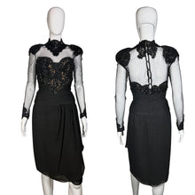 Load image into Gallery viewer, Black dress with sheer sleeves and embellishments on a mannequin against a neutral background