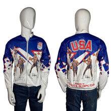Load image into Gallery viewer, Olympic-themed jacket with 'USA' and sports graphics on a mannequin against a gray background