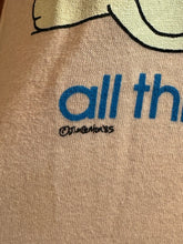 Load image into Gallery viewer, Close-up of a pink fabric with blue text and a signature.