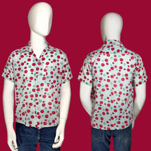Load image into Gallery viewer, Short-sleeve shirt with red and green polka dot smiley face pattern on mannequin against a plain background