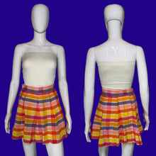 Load image into Gallery viewer, Front and back views of a vintage 1970s striped pleated skirt with a cream strapless tube top, displayed on white mannequins against a black background.