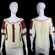 Load image into Gallery viewer, White peasant blouse with red accents on a mannequin against a white background