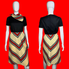 Load image into Gallery viewer, Mannequin wearing a three piece set featuring a black top and a chevron skirt with and without a matching scarf