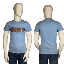 Load image into Gallery viewer, Blue t-shirt with graphic design on a mannequin against a plain background