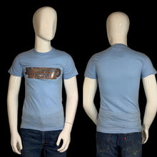 Load image into Gallery viewer, Blue t-shirt with graphic design on a mannequin against a plain background