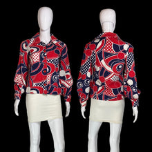 Load image into Gallery viewer, A long-sleeve collared blouse with a bold abstract geometric print in red, navy, white, and black, displayed on a white mannequin from both front and back views.