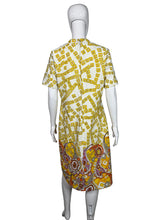 Load image into Gallery viewer, Yellow and white patterned dress on a mannequin