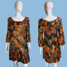 Load image into Gallery viewer, Floral patterned dress on a mannequin against a neutral background