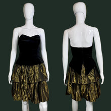 Load image into Gallery viewer, Black strapless dress with a gold tiered skirt on a mannequin against a plain background