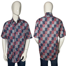 Load image into Gallery viewer, Mannequin wearing a patterned shirt with red and blue design on a plain background