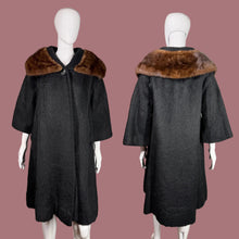 Load image into Gallery viewer, Black coat with brown fur collar on a mannequin against a neutral background