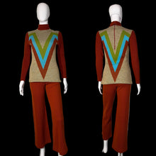 Load image into Gallery viewer, Mannequin wearing a vintage outfit with a red sweater and pants and a beige vest with colorful V-pattern on a white background.