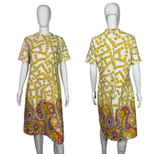 Load image into Gallery viewer, Yellow and white patterned dress on a mannequin