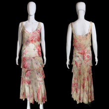Load image into Gallery viewer, A sleeveless tiered maxi dress with a pink and red floral print on a beige base, displayed on a white mannequin from both front and back views.