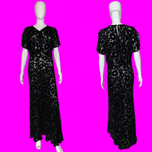 Load image into Gallery viewer, A black floral print silk burn out maxi dress displayed on a white mannequin, showing both front and back views.