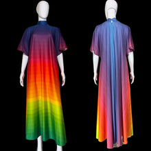 Load image into Gallery viewer, A long, short-sleeved dress displayed on a white mannequin from both front and back views. The dress features a vibrant rainbow gradient transitioning from dark purple at the shoulders to red, orange, yellow, green, and blue at the hem.