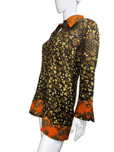 Load image into Gallery viewer, Mannequin wearing a patterned dress with orange, black, and yellow design on a plain background