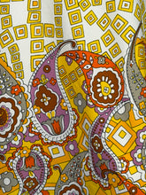 Load image into Gallery viewer, Close-up of a colorful patterned fabric with paisley designs.