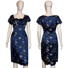 Load image into Gallery viewer, Navy blue dress with floral pattern on a mannequin against a plain background