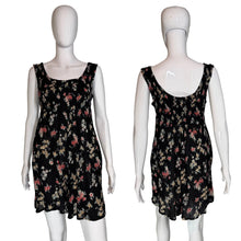 Load image into Gallery viewer, Black floral dress on a mannequin against a plain background