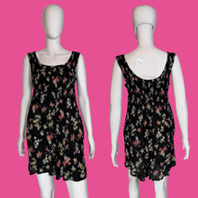 Load image into Gallery viewer, Black floral dress on a mannequin against a plain background