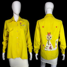 Load image into Gallery viewer, Yellow shirt with cat and flower design on a mannequin