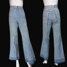 Load image into Gallery viewer, Light blue denim flare pants displayed on a mannequin from the front and back, featuring a grid-like patchwork pattern.