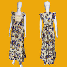 Load image into Gallery viewer, Floral dress on a mannequin against a plain wall.