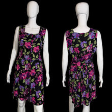 Load image into Gallery viewer, Floral romper on a mannequin against a neutral background