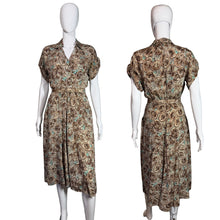 Load image into Gallery viewer, Patterned dress on a mannequin against a plain wall.
