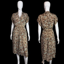 Load image into Gallery viewer, Patterned dress on a mannequin against a plain wall.