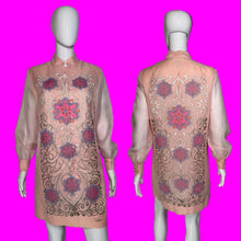 Load image into Gallery viewer, A pink embroidered tunic dress shown on a white mannequin from both front and back views. The dress features long sheer sleeves, a mandarin collar, and intricate floral and scroll embroidery in pink, purple, and gold.
