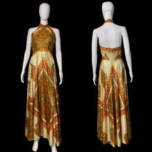Load image into Gallery viewer, Patterned dress on a mannequin against a plain wall.