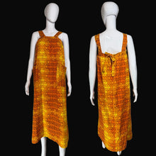 Load image into Gallery viewer, Orange patterned dress on a mannequin with front and back views against a plain background.