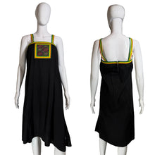 Load image into Gallery viewer, Black dress with colorful trim on a mannequin against a neutral background.