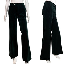 Load image into Gallery viewer, Dark green velvet pants displayed on a mannequin against a neutral background