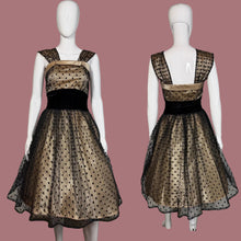 Load image into Gallery viewer, Black and cream polka dot dress on a mannequin with a plain background