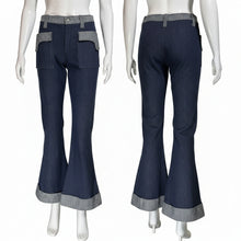 Load image into Gallery viewer, Blue bell-bottom pants on mannequins against a neutral background