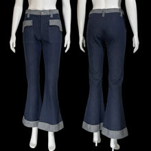 Load image into Gallery viewer, Blue bell-bottom pants on mannequins against a neutral background