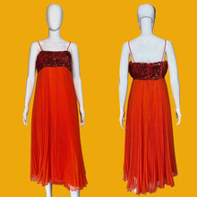 Load image into Gallery viewer, An orange-red spaghetti strap maxi dress with a sequined bodice, shown from both front and back views on white mannequins against a black background.