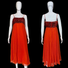 Load image into Gallery viewer, An orange-red spaghetti strap maxi dress with a sequined bodice, shown from both front and back views on white mannequins against a black background.