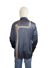 Load image into Gallery viewer, Mannequin wearing a dark blue shirt with decorative elements on a plain background