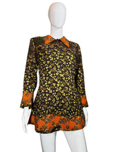 Load image into Gallery viewer, Mannequin wearing a patterned dress with orange and black design on a white background