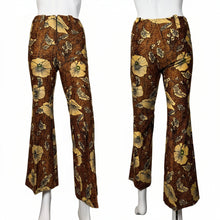 Load image into Gallery viewer, Brown floral-patterned pants on a mannequin against a white background