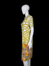 Load image into Gallery viewer, Yellow and white patterned dress on a mannequin